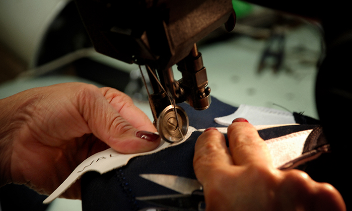 Hand making trainers inside the Walsh workshop, Bolton, England